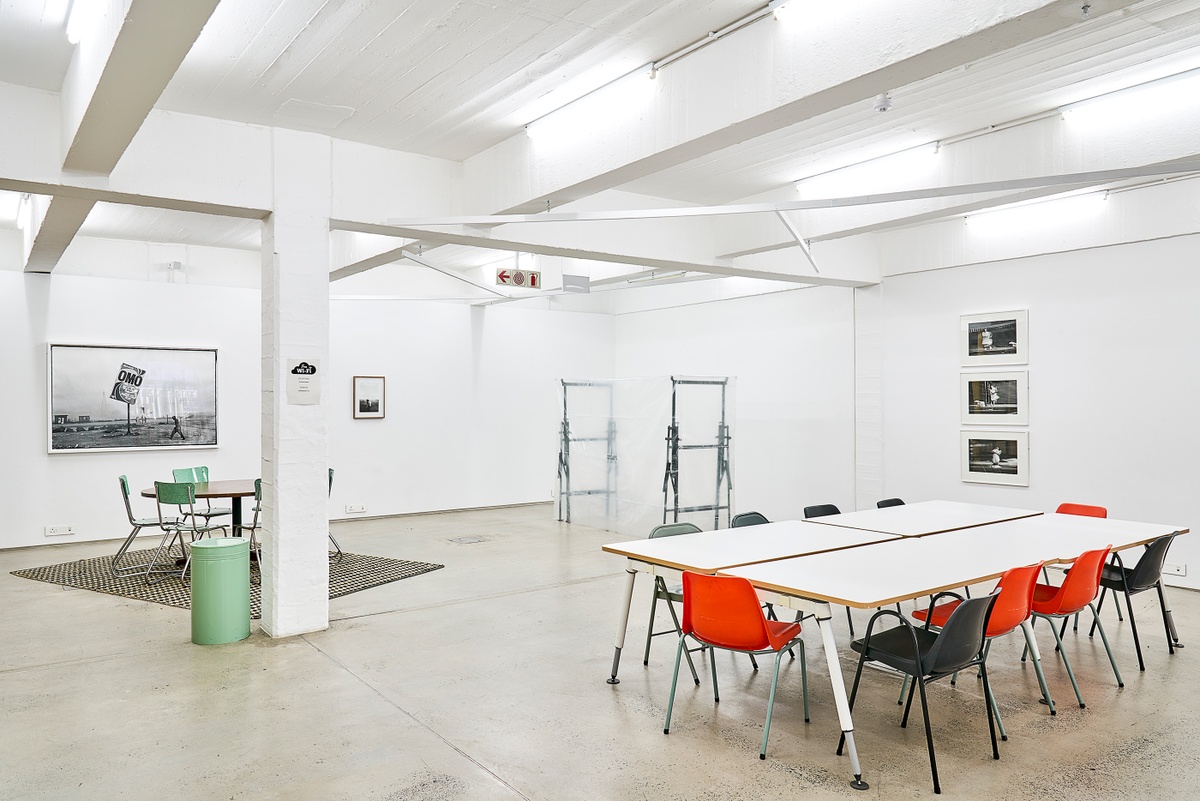 Installation photograph from the ‘Nowhere - No we're - Now here’ exhibition on A4’s ground floor. On the left, Santu Mofokeng’s photograph ‘Winter in Tembisa’ and Sabelo Mlangeni’s photograph ‘A morning after (UmlindeloUmlindelo wamaKholwa)’ are mounted on the gallery wall. In the middle, Gian Maria Tosatti’s mixed media installation ‘Void #2’ sits on the floor. On the right, Sabelo Mlangeni’s photographic series ‘Invisible Woman’ is mounted on the wall.
