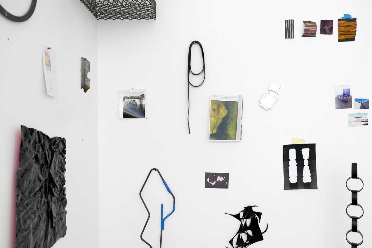 Installation photograph from the 2018 rendition of ‘Parallel Play’ in A4’s Gallery. Various sculptural objects and ephemera from Kyle Morland’s practice are arranged on the walls in a corner of the gallery.
