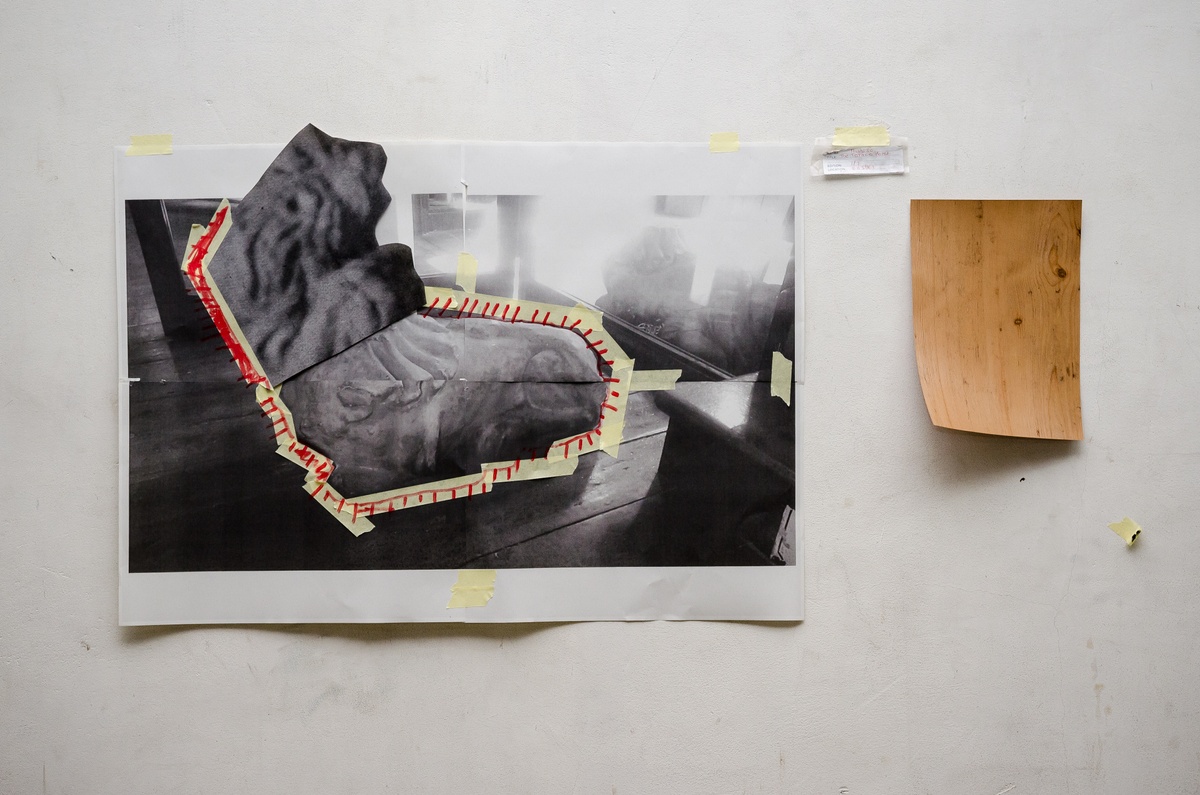 Process photograph from Dorothee Kreutzfeldt’s residency on A4’s 1st floor that depicts a closeup view of a wall. On the left, a photocopy collage with masking tape and felt pen marker drawings. On the right, a small sheet of wood imitate laminate.
