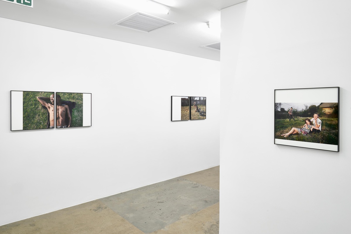 Installation photograph from the ‘Tell it to the Mountains’ exhibition in A4’s Gallery. On the left, Lindokuhle Sobekwa’s photographs ‘Mandla’ and ‘Brothers fighting’ are mounted on the wall. On the right, Sobekwa’s photograph ‘Jordan and Nadine’ is mounted on the wall.
