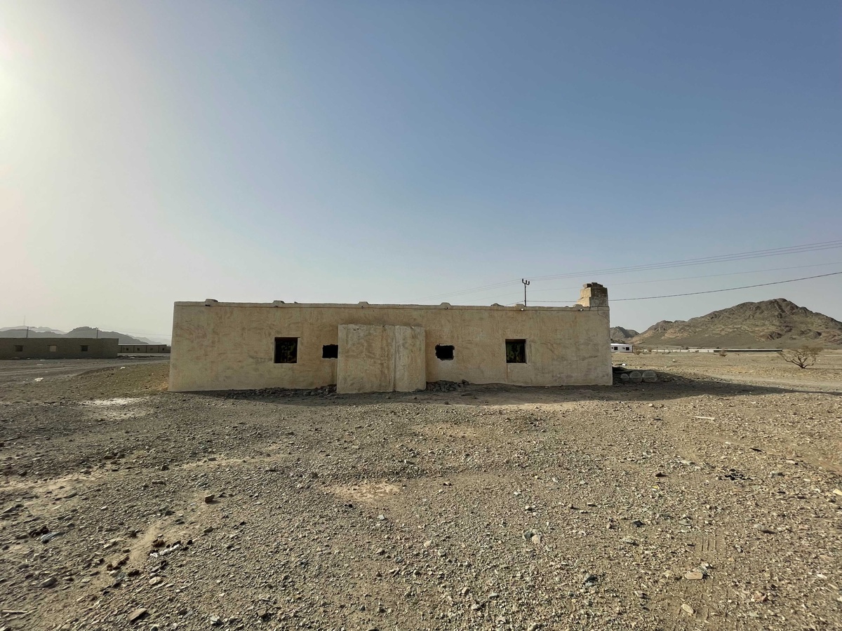 Process photograph from Waiting Upon, Sumayya Vally’s Course of Enquiry at A4, depicting a roadside mosque in Saudi Arabia in an arid landscape with a mountain in the background.
