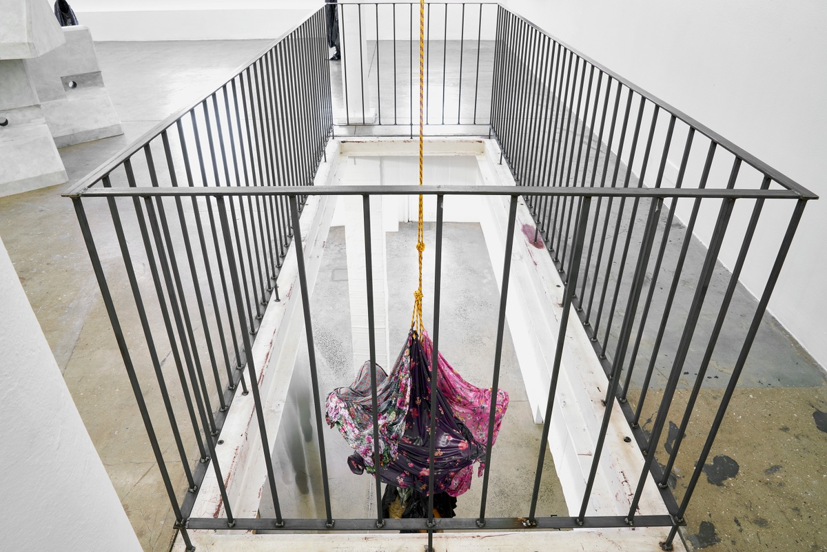 Installation photograph from the ‘without a clear discernible image’ exhibition in A4’s Gallery. Kevin Beasley’s untitled garment and resin sculpture is suspended into the foyer through an opening in the gallery floor.
