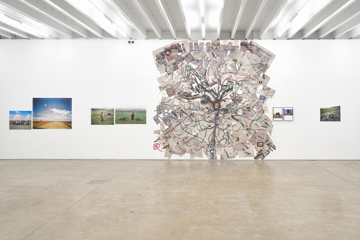 Installation photograph from the ‘Tell it to the Mountains’ exhibition in A4’s Gallery. On the left, Lindokuhle Sobekwa’s photographs ‘Amakhwenkwe’ and ‘Tsojana bus stop’ are mounted on the wall. In the middle, Sobekwa’s paper and photo collage ‘Mthimkhulu II’ is pasted onto the wall. On the right, Sobekwa’s photographs ‘Bhayi alembathwa lembathwa ngabalaziyo’, ‘Veld fire’ and ‘Zenandi’ are mounted on the wall.
