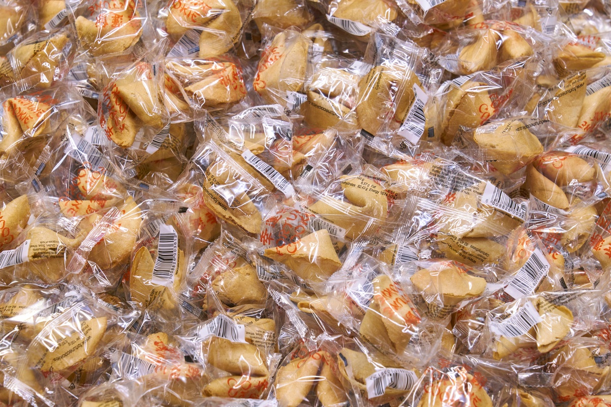 Installation photograph of Felix González-Torres' ‘Untitled (Fortune Cookie Corner)’ in A4’s elevator, with wrapped fortune cookies piled against the back of the interior.
