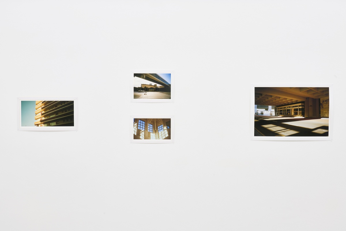 Installation photograph from the ‘Missing Subject’ exhibition in A4’s Library. On the left, Andile Phewa’s photograph ‘Quiet Corner’ is mounted on the wall. In the middle, Phewa’s photographs ‘Train Station’ and ‘Gardens’ is mounted on the wall. On the right, Phewa’s photograph ‘Civic Center’ is mounted on the wall.
