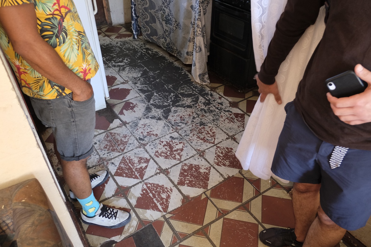 Process photograph from a visit to the Bonteheuwel township that formed part of ‘Open Production’, Igshaan Adams’ hybrid studio/exhibition in A4’s Gallery, that shows patterned kitchen tiles with significant erosion.
