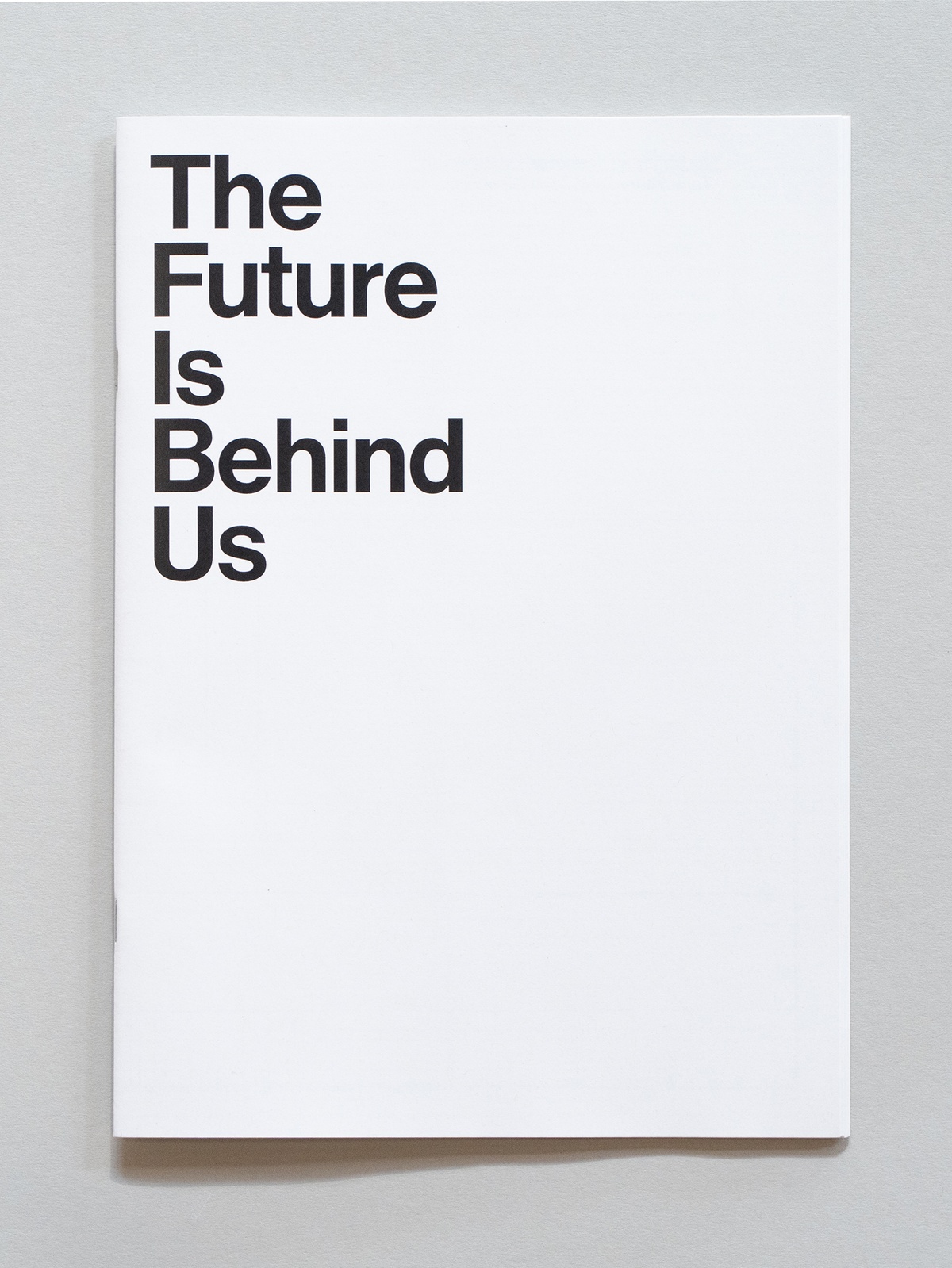 Photograph of the wayfinder publication for The Future is Behind Us, curated by Josh Ginsburg in A4 Arts Foundation's Gallery.
