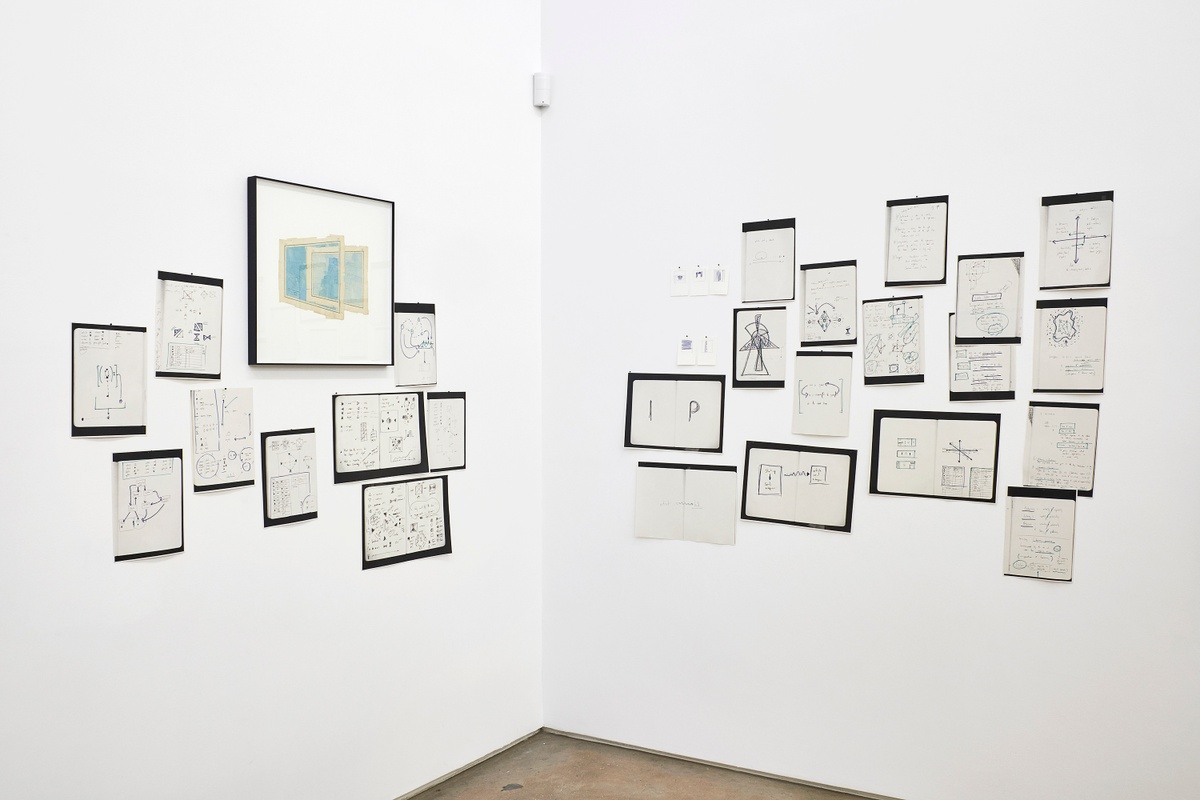 Installation photograph from the 2018 rendition of ‘Parallel Play’ in A4’s Gallery. On the left, Gerhard Marx’s mixed media collage ‘Depths in Feet (Echo)’ is mounted on the gallery wall, along with photocopies from a notebook. On the right, photocopies from a notebook are pasted onto the gallery wall.
