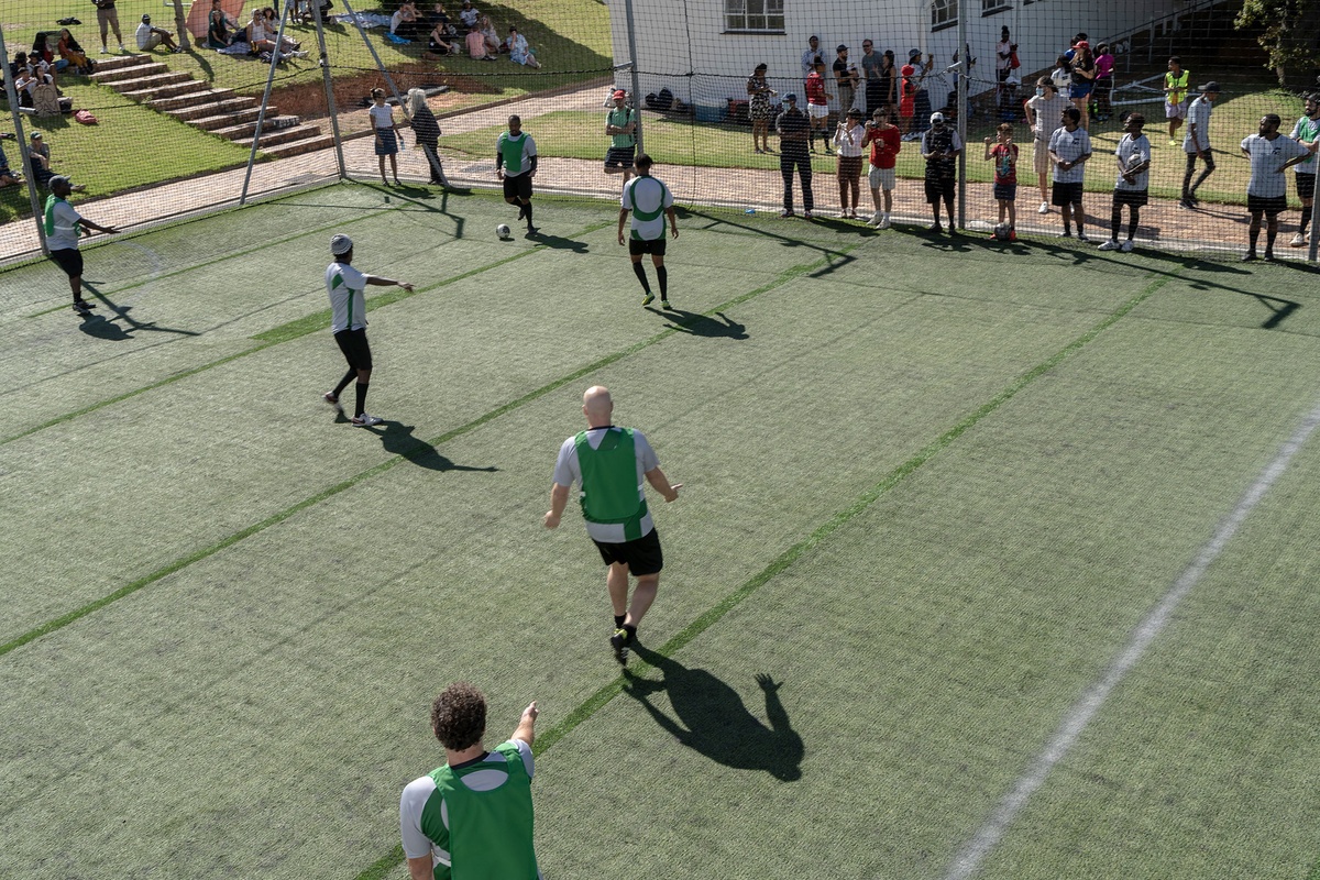 Match day photograph from the 2022 rendition of Exhibition Match that shows players participating in a soccer match.
