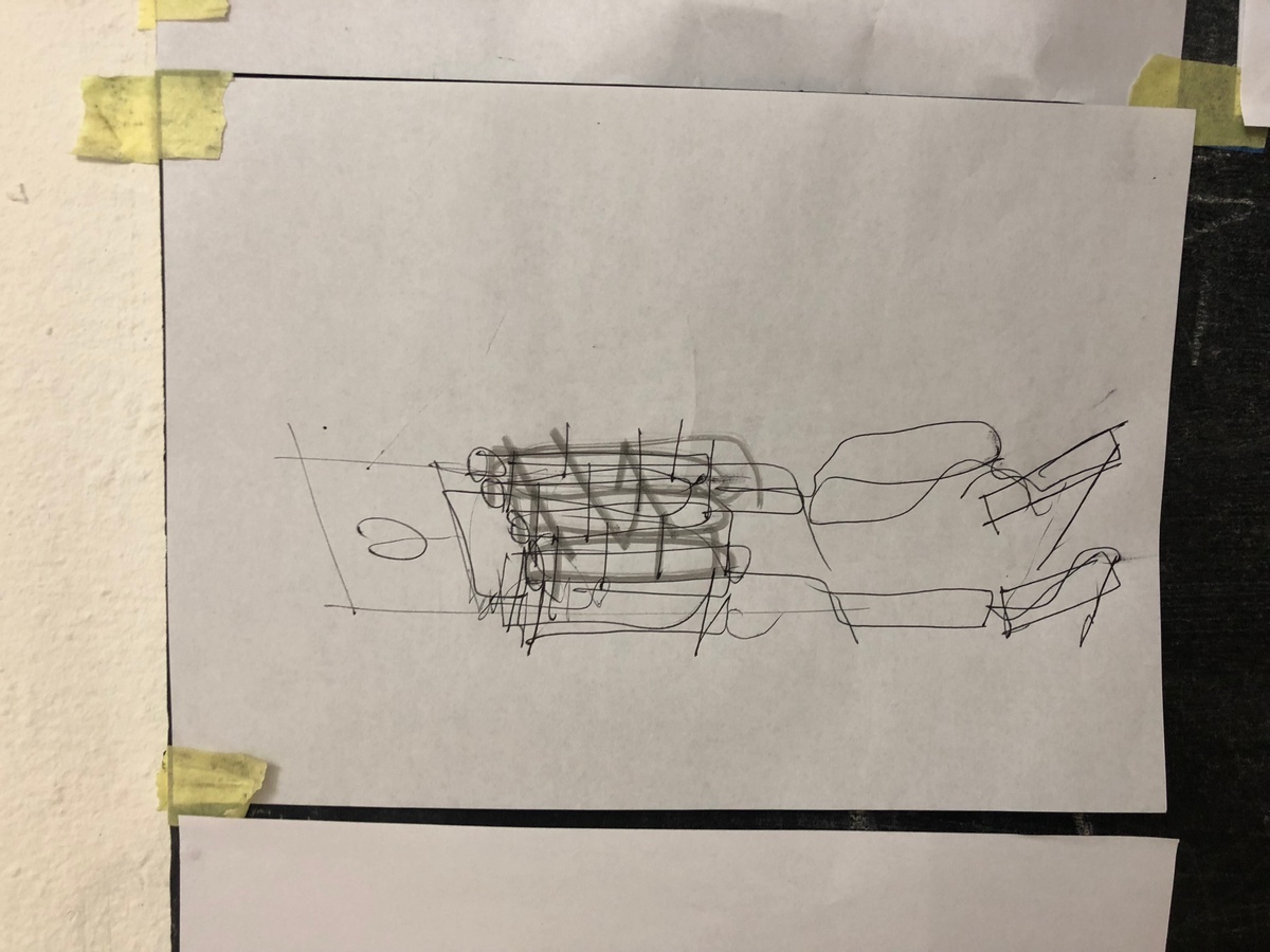 Process photograph from Unathi Mkonto’s interactive installation ‘AVOID’ on A4’s ground floor that shows a wall-mounted charcoal and pen drawing on newsprint.
