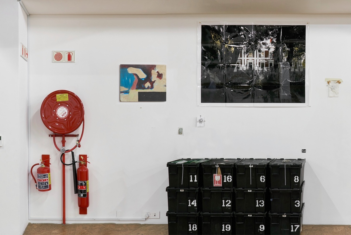 Installation photograph from ‘Archive as Terrarium: Part 3’ on A4’s top floor. At the front, Christian Nerf’s ‘Lockboxes’ sits at the base of the wall. On the left, Nerf’s ‘Cash in Transit’ is mounted on the gallery wall. In the middle, Nerf’s ‘God-Save-The-Queen’ and ‘Teaching Teachers’ is mounted on the wall. On the right, Nerf’s ‘I May Need Gloves’ is mounted on the wall.
