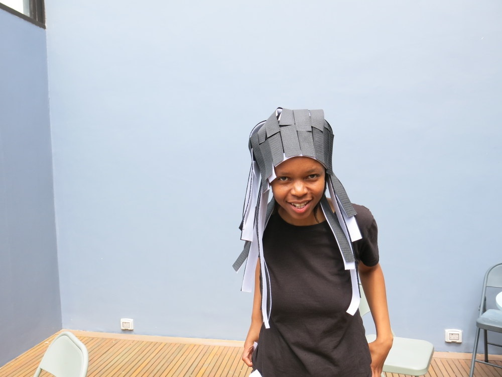 Process photograph from the ‘Wearables’ workshop with Unathi Mkonto on A4’s top floor that shows an attendee with a velcro wearable headpiece.
