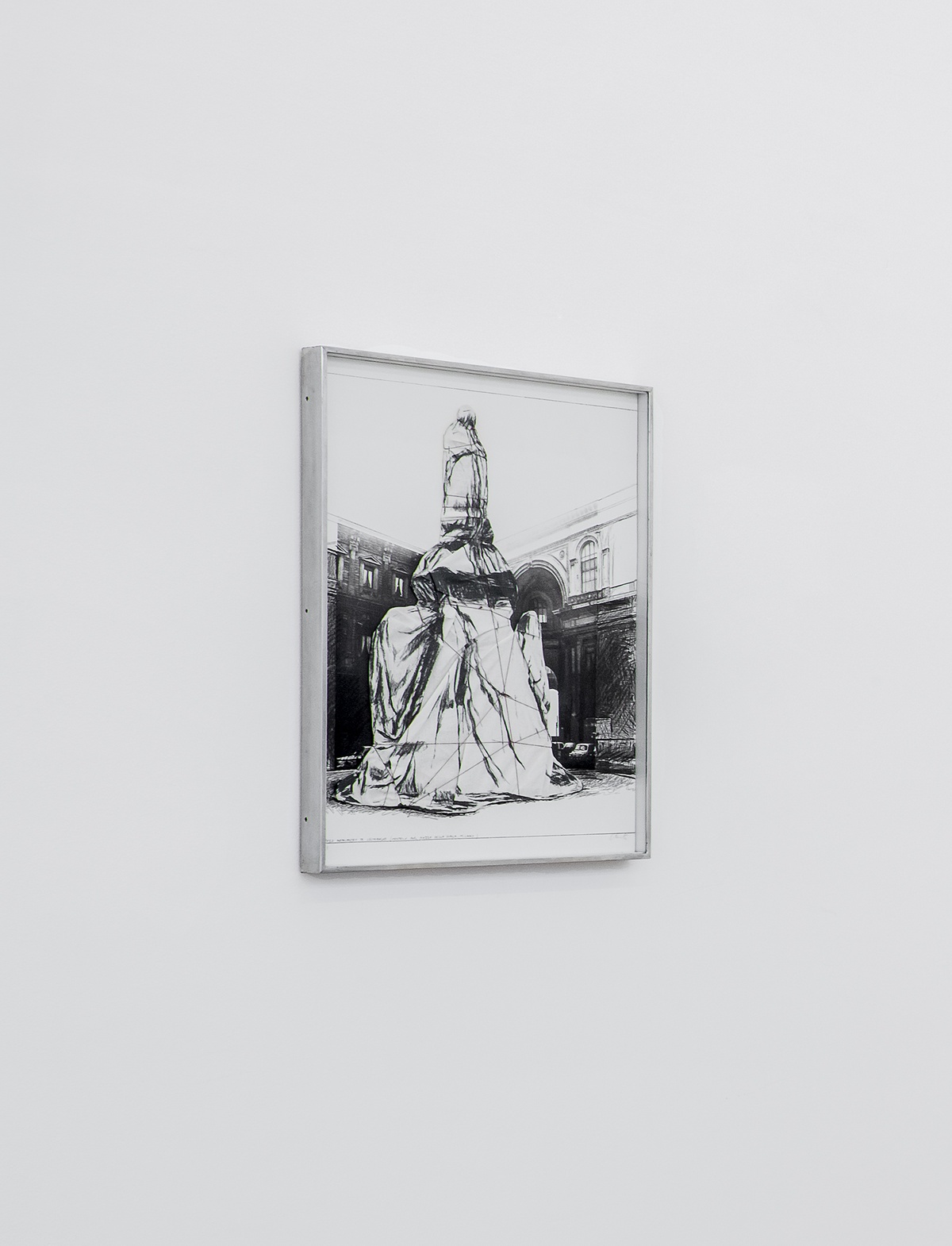 A photograph of Christo's collotype print and collage 'Wrapped monument to Leonardo, Project for the Piazza Della Scala, Milan'.
