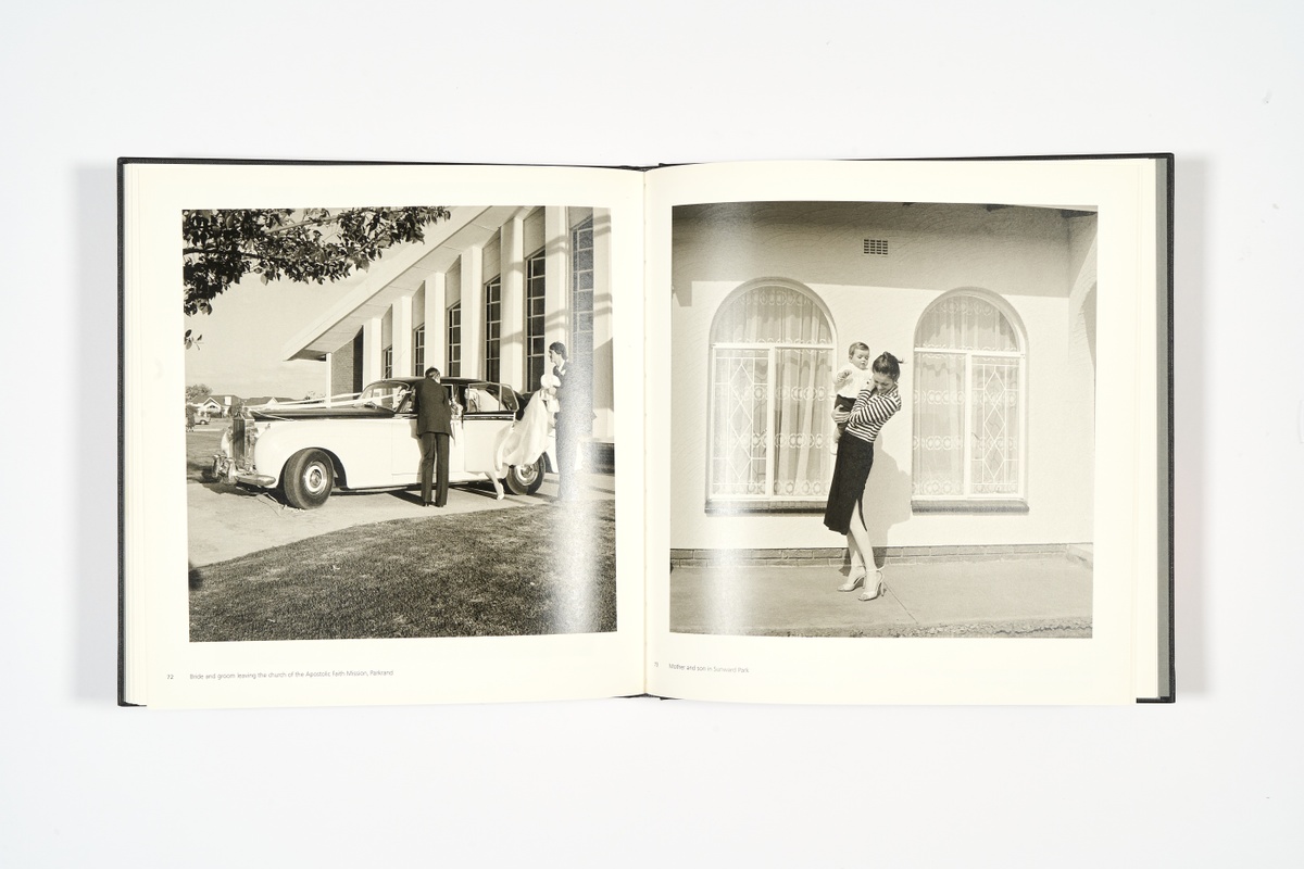 A topdown photograph of a 2-page spread from David Goldblatt's photo-book 'In Boksburg' on a white background.
