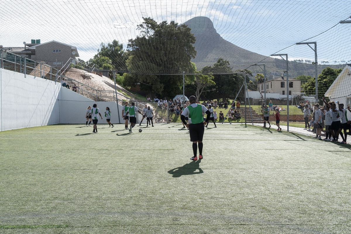 Match day photograph from the 2022 rendition of Exhibition Match that shows players participating in a soccer match.
