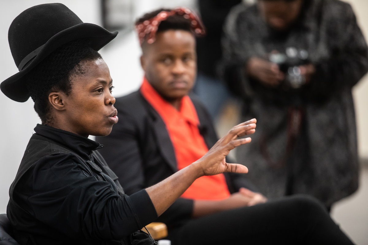 Event photograph from ‘Bare in Conversation with Sir Professor Zanele Muholi’, Session 1 of the ‘Bare Stories’ series hosted on A4’s ground floor. A closeup view depicts visual activist Zanele Muholi and Welcome Lishivha in conversation.
