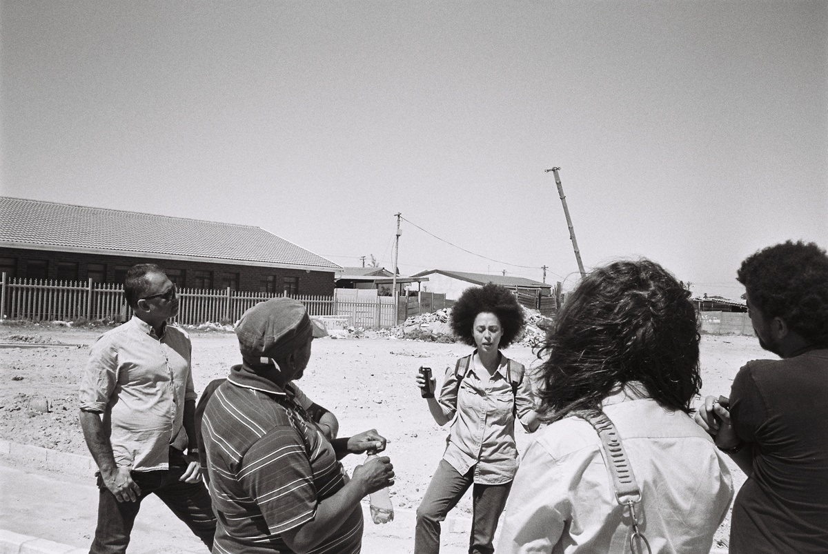 A photography from the Gladys' House workshop coordinated by Kemang Wa Lehulere in NY1, Guguletu shows a group of individuals in discussion.
