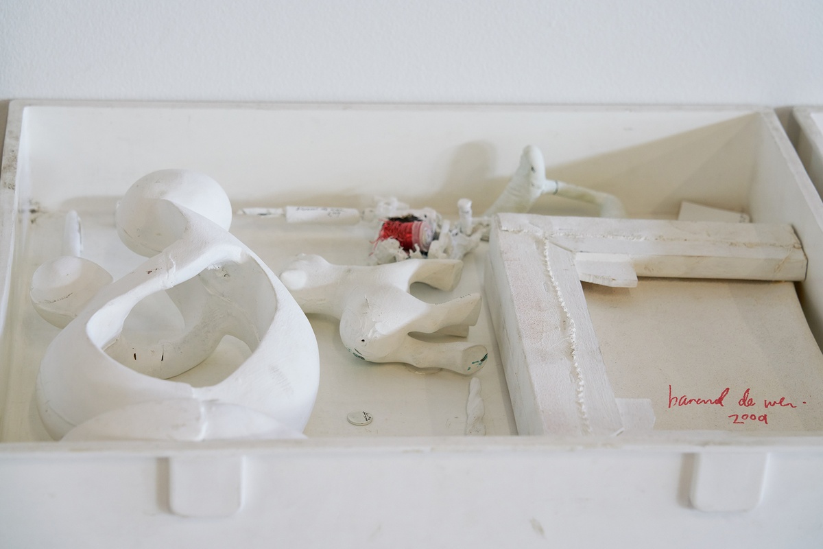 Process photograph from Christian Nerf’s residency at A4 Arts Foundation shows a collection of white coloured objects in flat white box.
