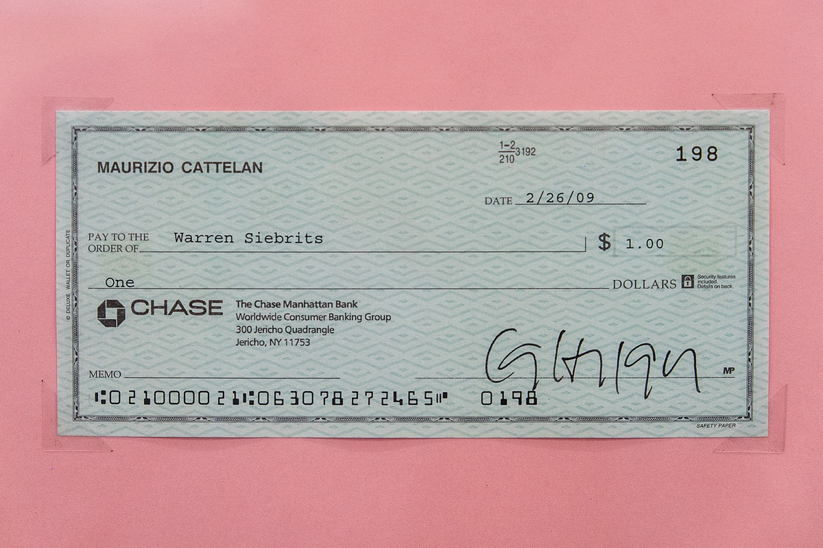 A photograph of Maurizio Cattelan's untitled cheque made out to Warren Siebrits for the amount of one dollar.
