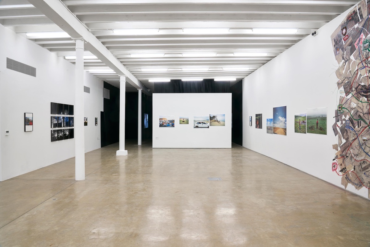 Installation photograph from the ‘Tell it to the Mountains’ exhibition in A4’s Gallery. At the back, Lindokuhle Sobekwa’s photographs are mounted on a moveable wall. On the left and right, Sobekwa’s photographs are mounted on the gallery walls.
