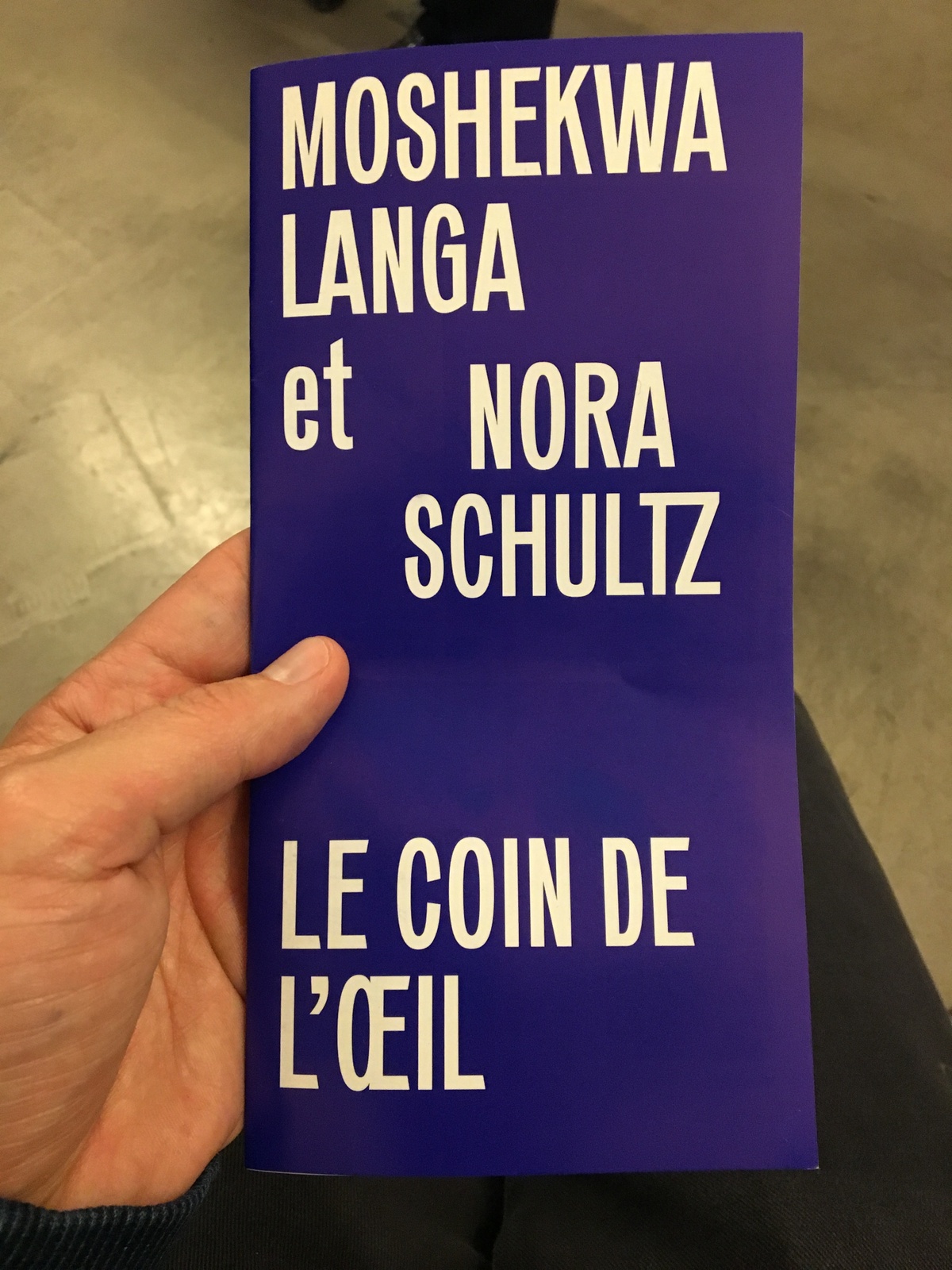 Process photograph from the offsite ‘Corner of the Eye / Le Coin de L’oeil’ exhibition at the Kadist Art Foundation, Paris shows a blue and white flyer that reads ‘Moshekwa Langa et Nora Schultz, Le Coin de L’Œil’.
