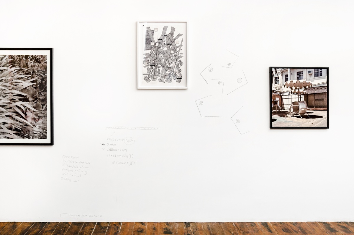 Installation photograph from the ‘Between Two or More Worlds’ exhibition at the 2016/2017 A4 Office that shows three wall mounted artworks interspersed with charcoal drawings and writing. On the left, George Hallet’s photographic diptych ‘Peter Clarke’s Tongue’. On the right, Thabiso Sekgala’s photograph ‘The Terrace Hotel, Hulawayo’.
