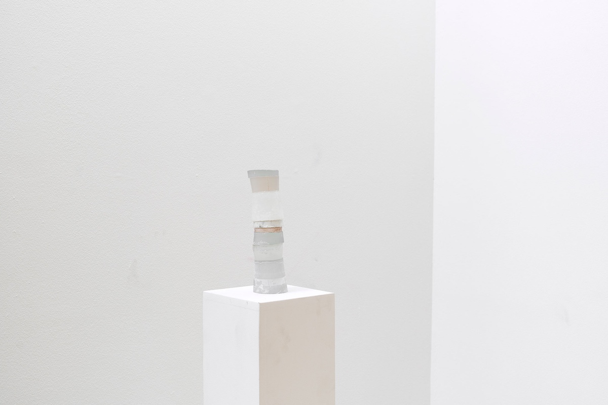 Process photograph from Kyle Morland’s working space during the 2nd rendition of ‘Parallel Play’ in A4’s Gallery. A small painted sculptural object sits on a white plinth.
