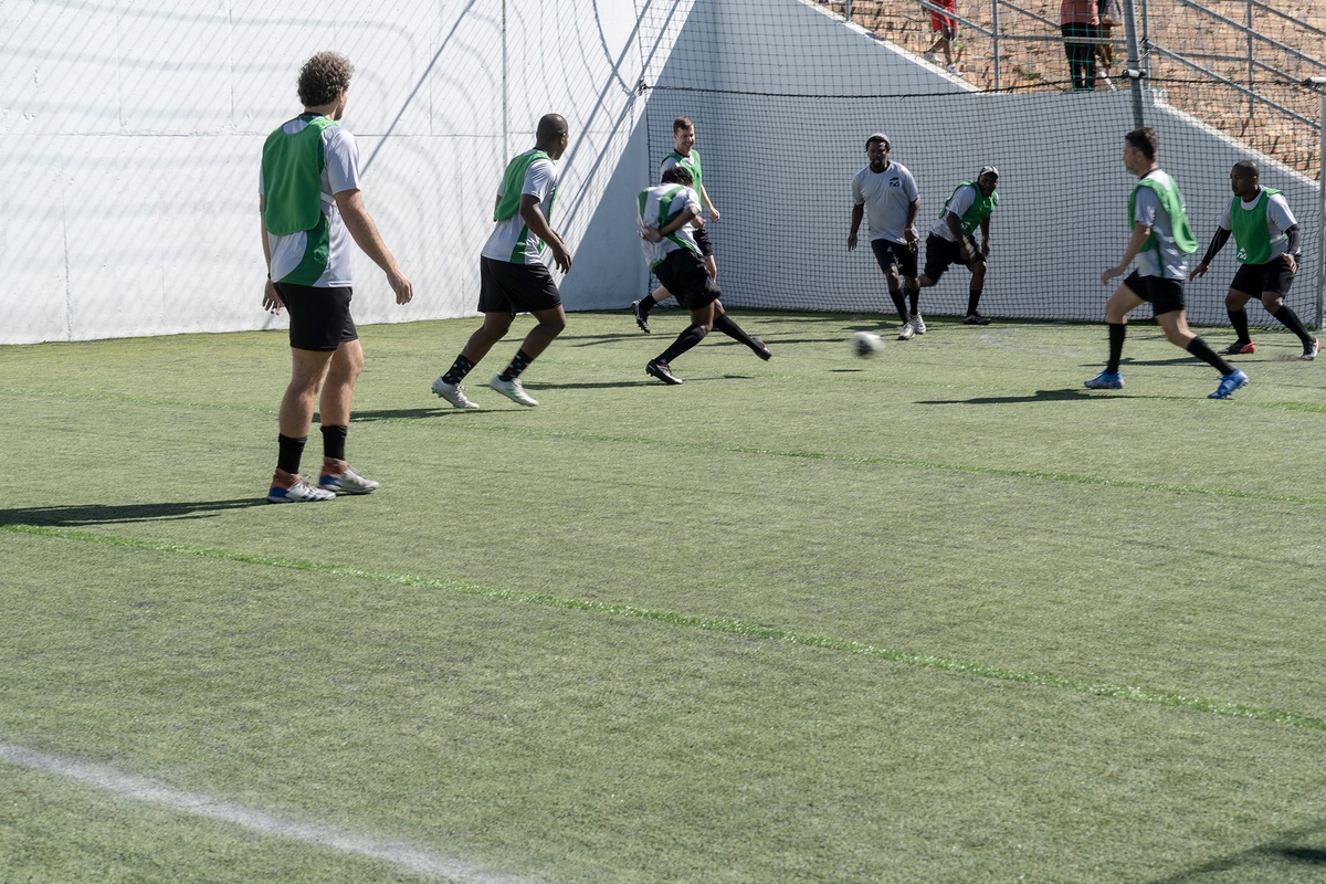 Match day photograph from the 2022 rendition of Exhibition Match that shows players participating in a soccer match.
