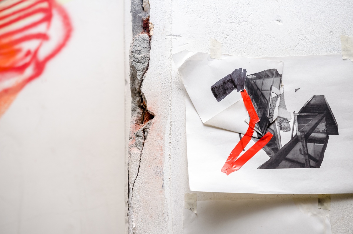 Process photograph from Dorothee Kreutzfeldt’s residency on A4’s 1st floor. A folded photographic collage with red electric tape.
