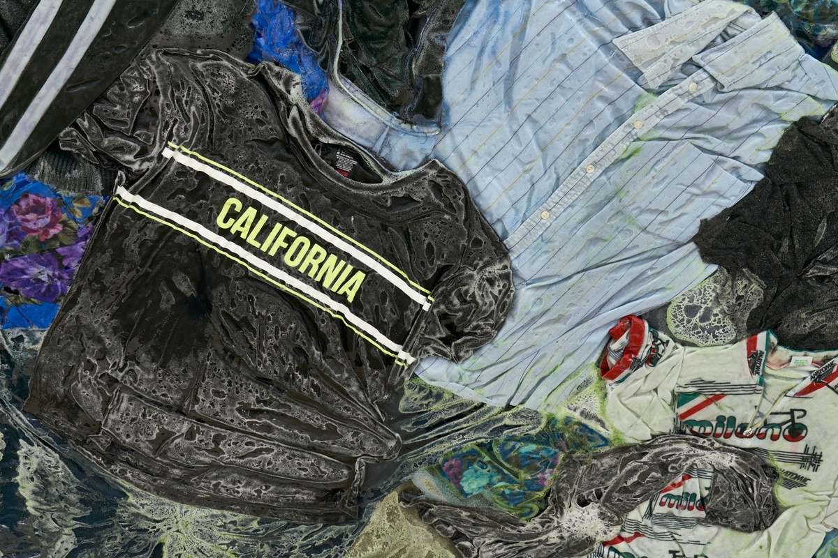 Artwork photograph from the ‘without a clear discernible image’ exhibition in A4’s Gallery. A closeup view of Kevin Beasley’s resin, metal and garment work ‘California South Africa’ shows a resin hardened t-shirt with the word ‘California’ printed on it.
