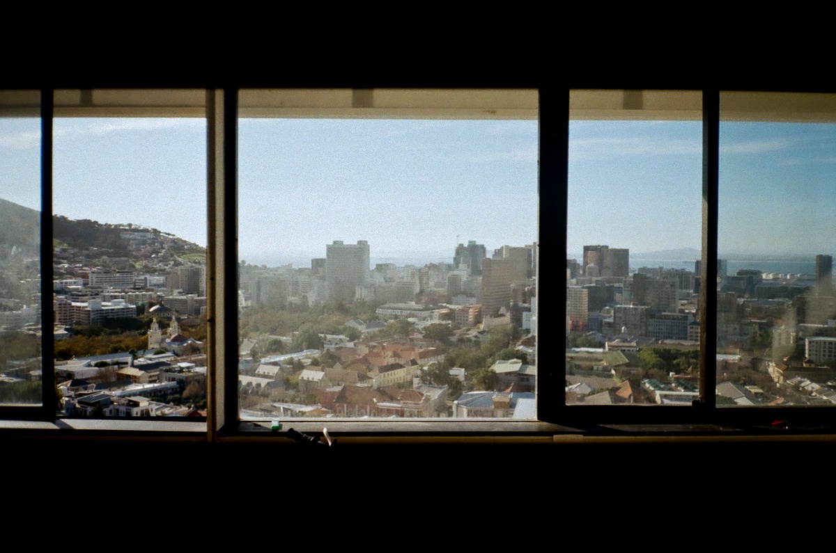 Artwork image from the ‘Missing Subject’ exhibition in A4’s Library. Andile Phewa’s photograph ‘1604’ depicts the cityscape of Cape Town through a strip of windows.
