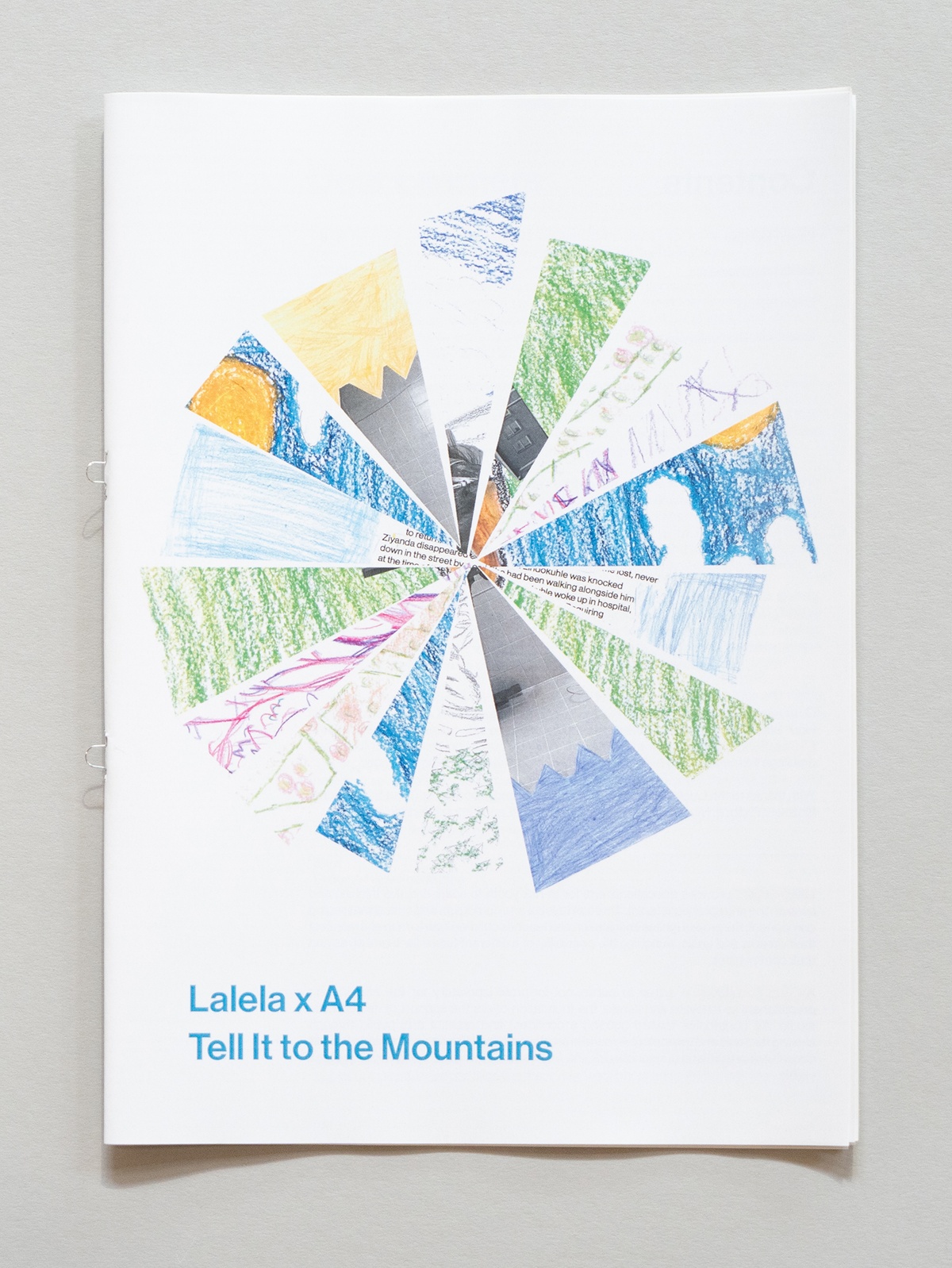 A top-down photograph of the publication for the Lalela programme's interaction with the Tell It to the Mountains exhibition in A4's Gallery.
