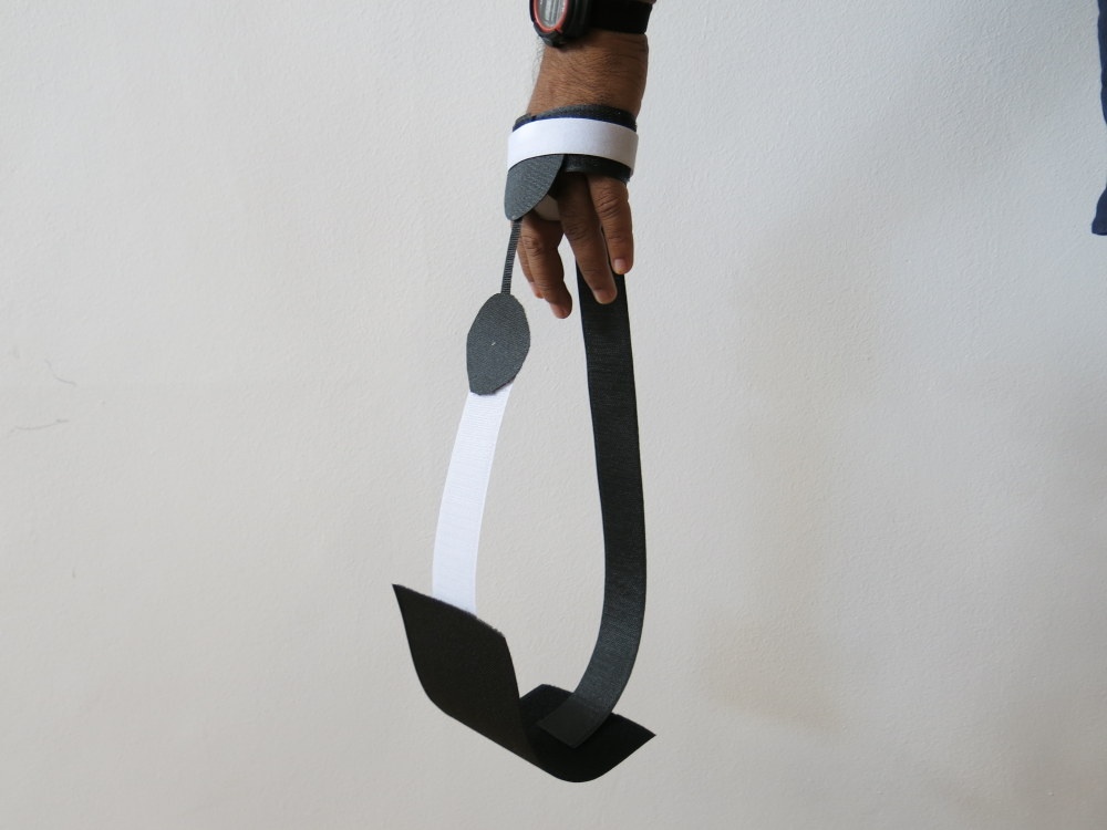 Process photograph from the ‘Wearables’ workshop with Unathi Mkonto on A4’s top floor that shows a hand with a velcro wearable suspended from it.
