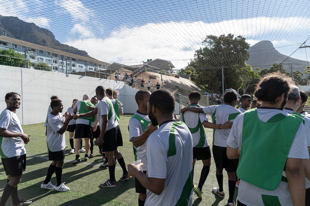 Match day photograph from the 2022 rendition of Exhibition Match that shows players after a soccer match.
