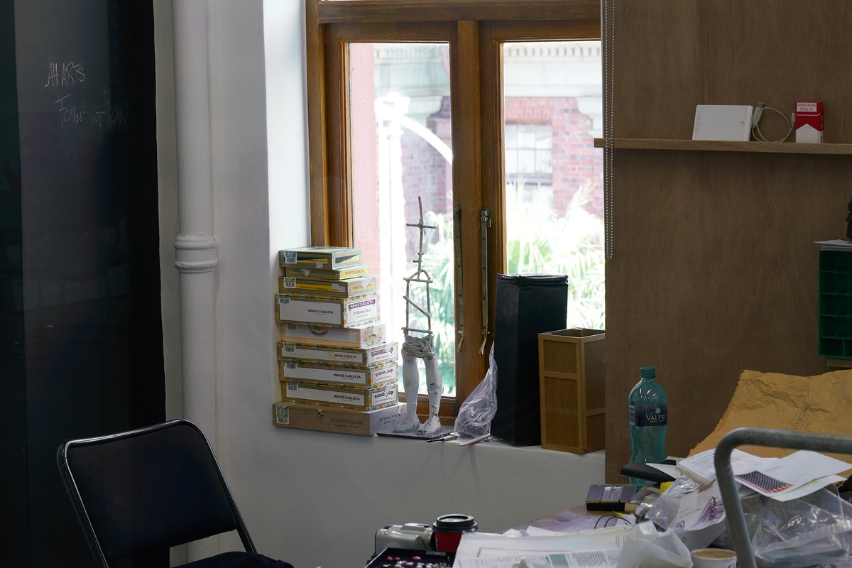 Process photograph from Christian Nerf’s residency at A4 Arts Foundation shows a collection of books sitting in a window sill.
