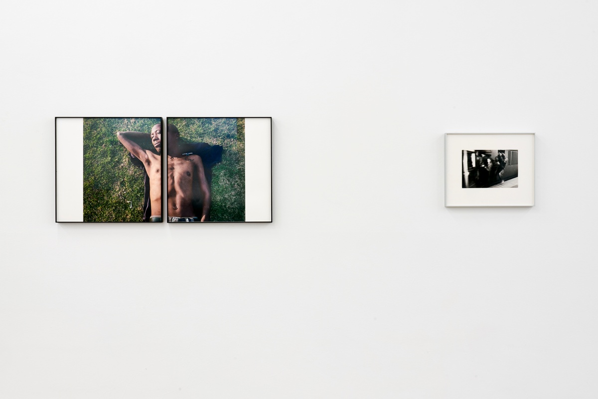 Event photograph from the roundtable discussion that accompanied the ‘Tell It to the Mountains’ exhibition in A4’s gallery. On the left, Lindokuhle Sobekwa’s photograph ‘Mandla’ is mounted on the gallery wall. On the right, Ernest Cole’s untitled monochrome photograph is mounted on the gallery wall.
