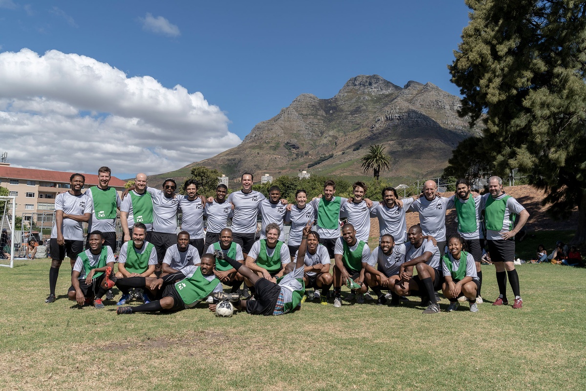 Match day photograph from the 2022 rendition of Exhibition Match that shows a mix of soccer players from various teams.
