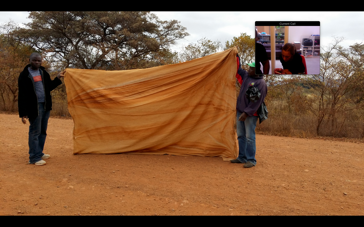 Process image from the offsite ‘Corner of the Eye / Le Coin de L’Œil’ exhibition at the Kadist Art Foundation, Paris. A screenshot from a video call between Nora Schultz, Moshekwa Langa, Josh Ginsburg and francis burger that includes an image from the making of Langa’s soil and canvas ‘Drag paintings’. 
