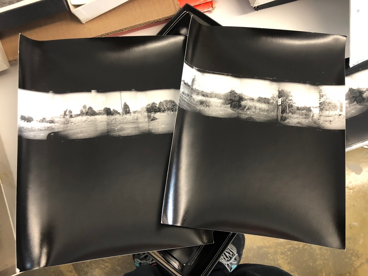 Process photograph from the offsite exhibition ‘Hay Tiempo, No Hey Tiempo’ at the Centro Fotográfico Álvarez Bravo, Mexico. Two photographic prints arranged on a desk.
