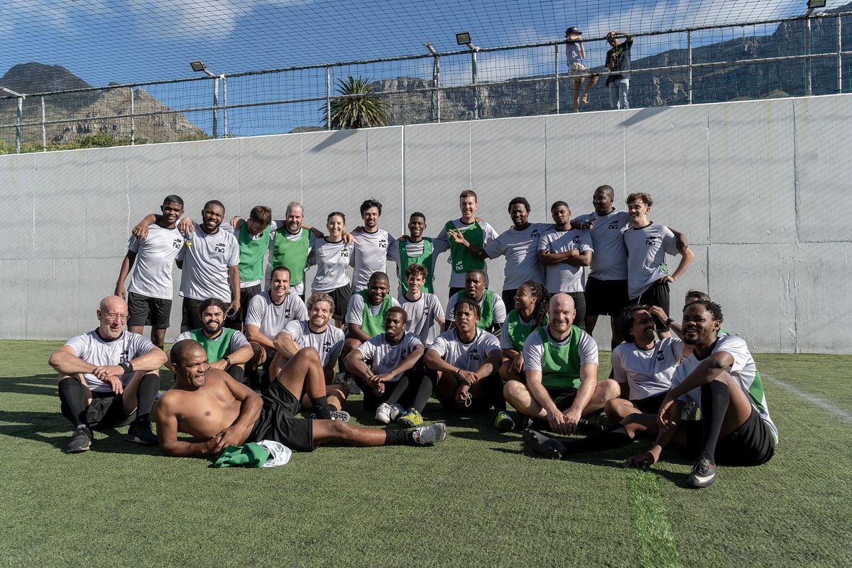 Match day photograph from the 2022 rendition of Exhibition Match that shows a team of soccer players.
