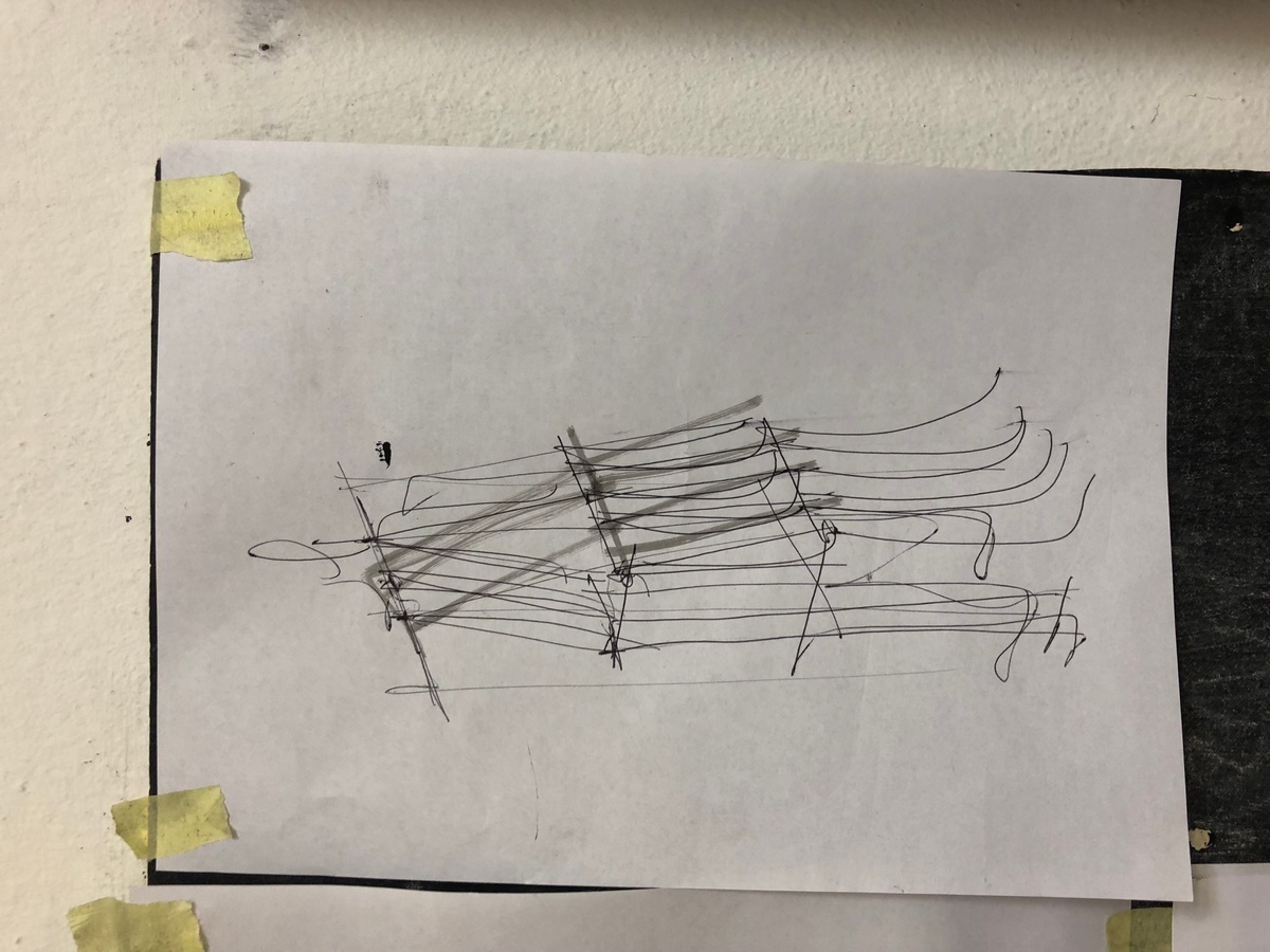 Process photograph from Unathi Mkonto’s interactive installation ‘AVOID’ on A4’s ground floor that shows a wall-mounted charcoal and pen drawing on newsprint.
