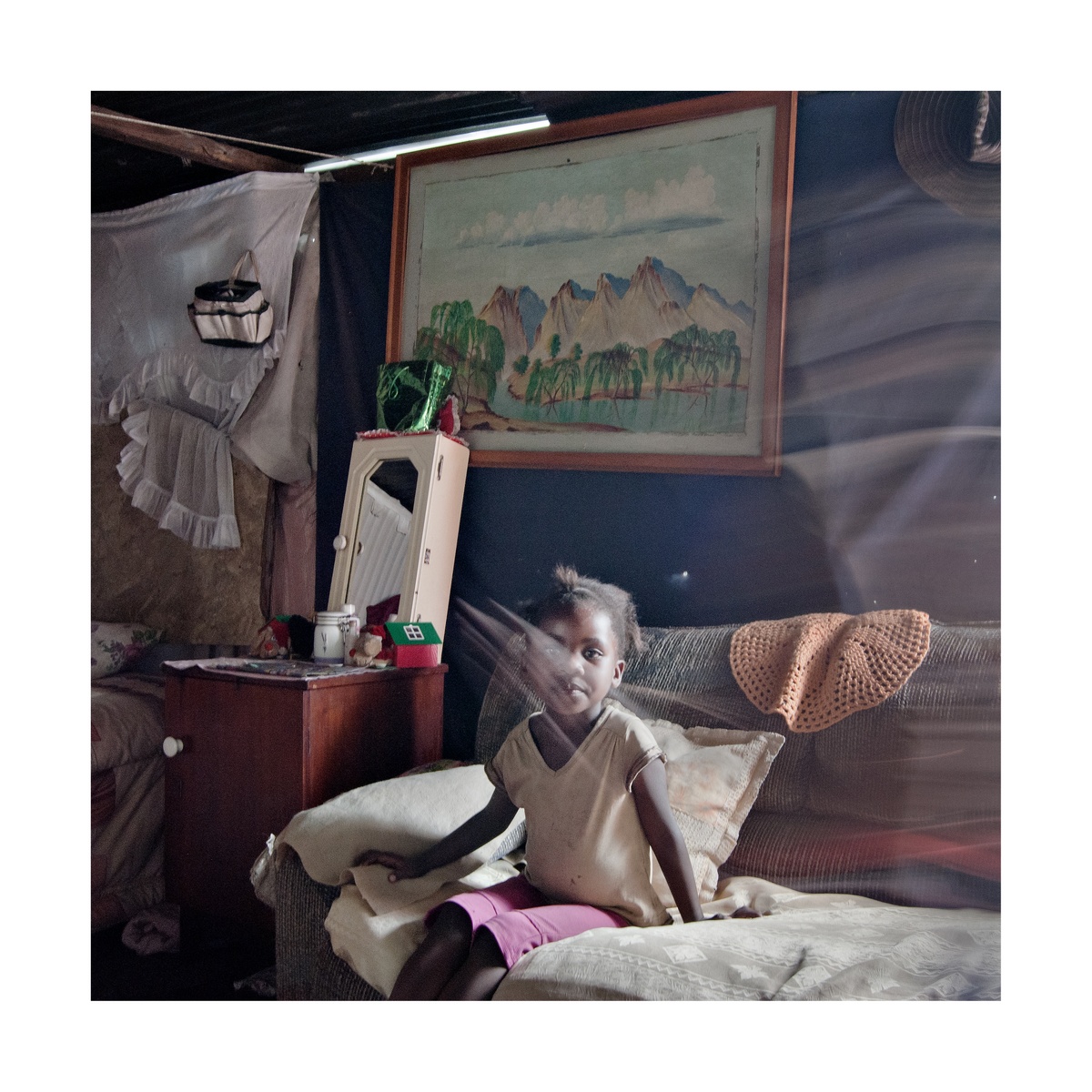 Photograph from Jabulani Dhlamini’s residency on A4’s top floor shows a child sitting on a couch.
