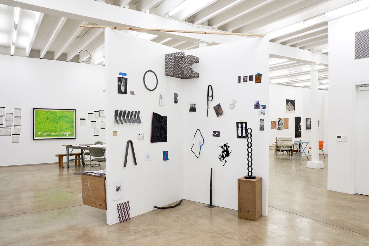 Installation photograph from the 2018 rendition of ‘Parallel Play’ in A4’s Gallery. On the left, Moshekwa Langa’s gouache and pencil work ‘I Am So Sorry (Green)’ is mounted on the gallery wall, along with photocopies from a notebook. In the middle, Kyle Morland’s sculptural objects are mounted on a freestanding wall.
