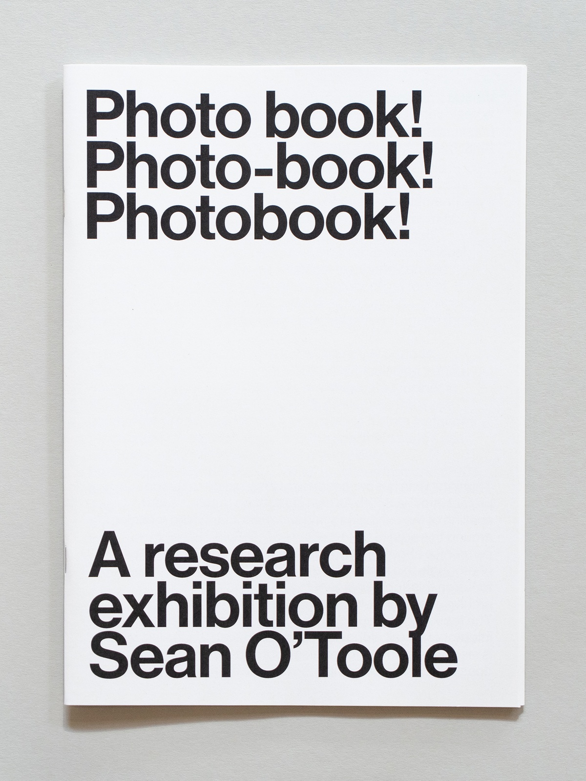 Photograph of the wayfinder publication for Photo Book! Photo-Book! Photobook! curated by Sean O'Toole in A4 Arts Foundation's Gallery.
