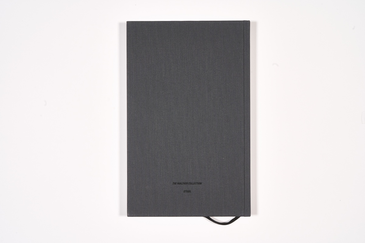 A topdown photograph of the back cover of Mikhael Subotzky and Patrick Waterhouse's photo-book 'Ponte City' on a white background.
