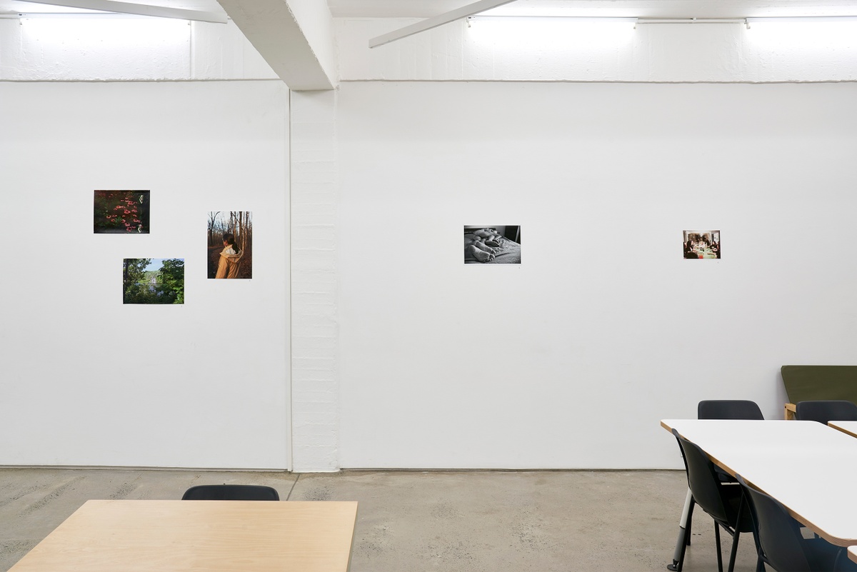 Installation photograph from the ‘In Your Place’ exhibition on A4’s ground floor. On the left, Andrea Martucci’s photograph “from Of this Being,” Genevieve Fournier’s photograph “Untitled (Mom)” and Ali Di Lucia’s photograph ‘Cliff jump’ are mounted on the wall. On the right, Michael McFadden’s photograph ‘Untitled (Spoon)’ and Lauren Tabenfield’s untitled photograph are mounted on the wall.
