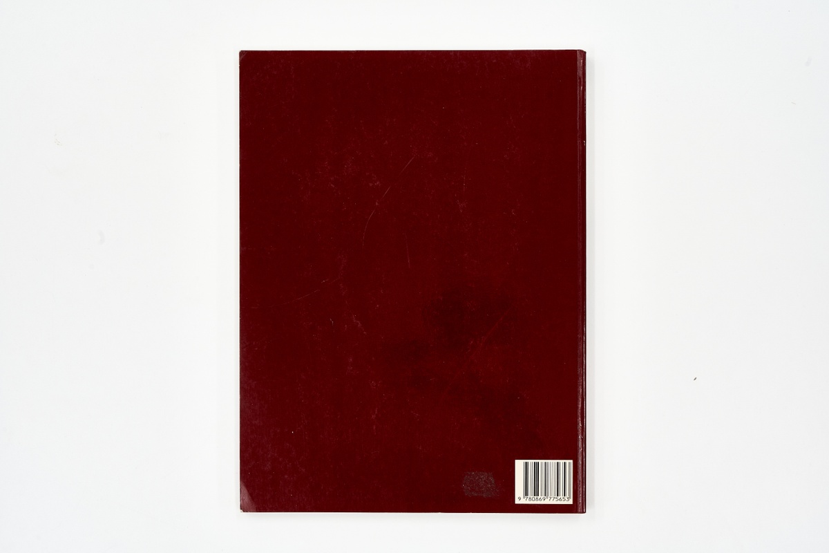 A topdown photograph of the back cover of Alice Mertens' photo-book 'African Elegance' on a white background.
