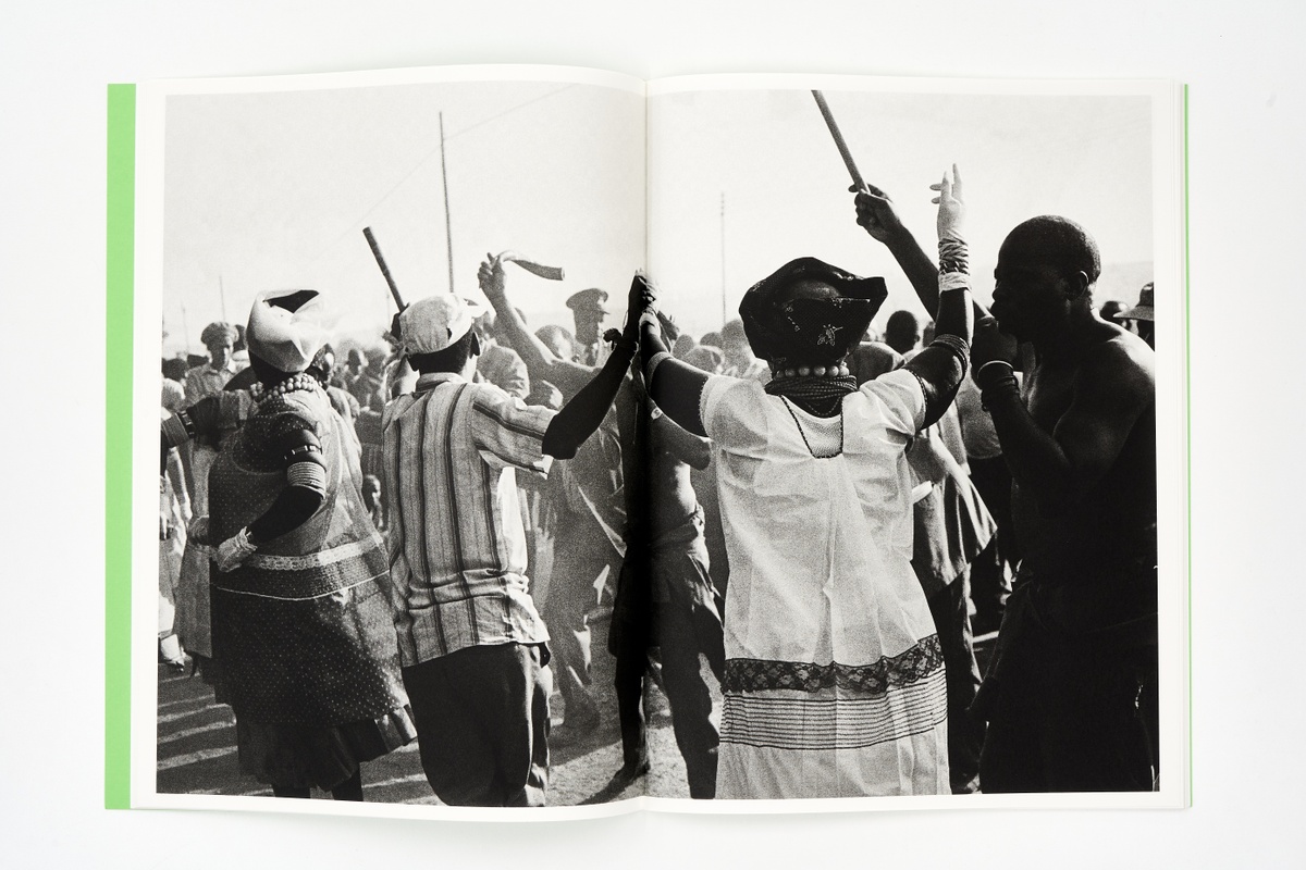 A topdown photograph of a 2-page spread from a booklet that forms part of Santu Mofokeng's photo-book project 'Stories' on a white background.
