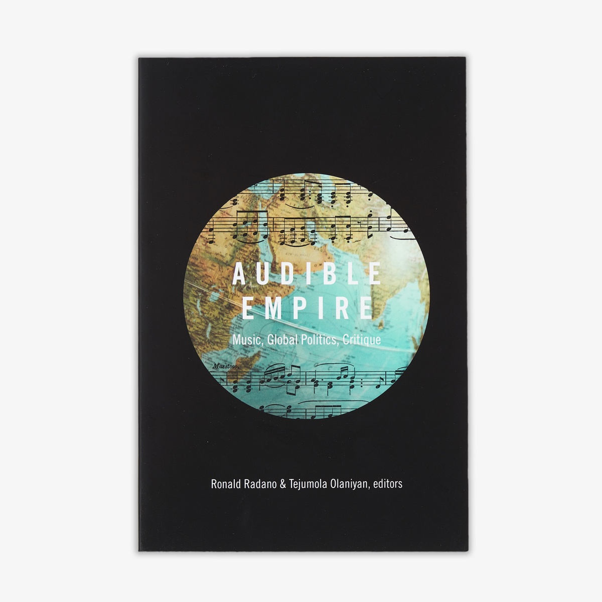 Photograph of the cover of Ronald Radano and Tejumola Olaniyan's edited volume 'Audible Empire: Music, Global Politics, Critique'.
