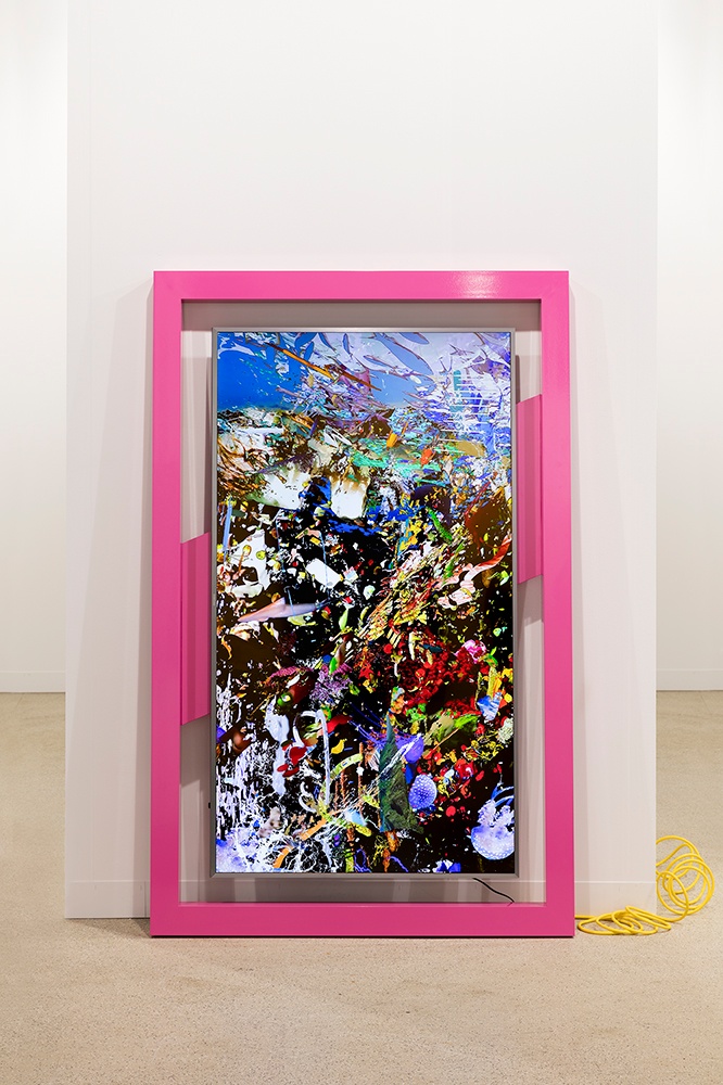 A photograph of Borna Sammak's video sculpture 'Not Yet Titled' leaning against a white wall.
